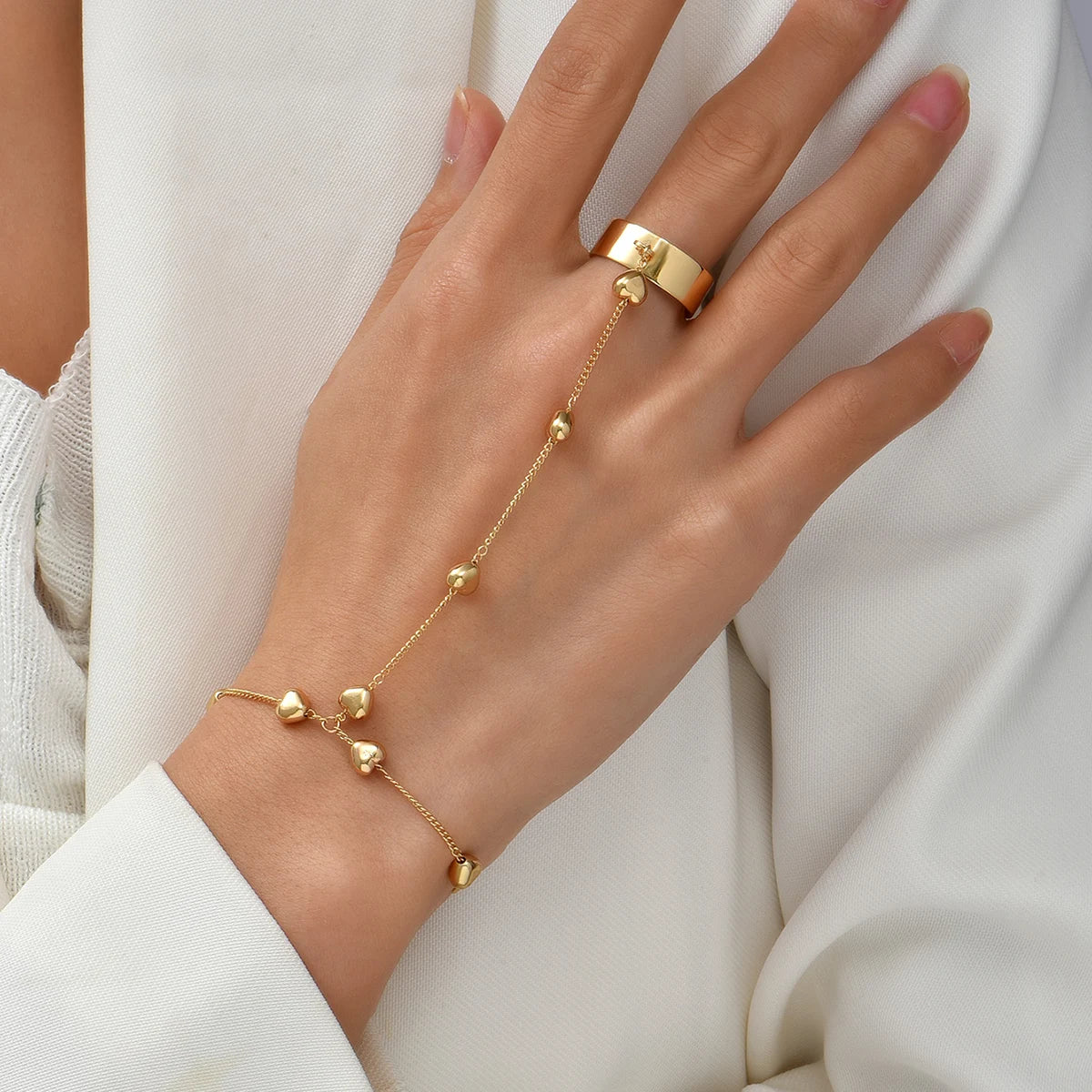 Chain bracelet finger rings gold color