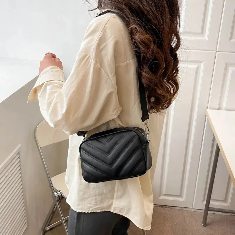 Crossbody bag with wide shoulder strap