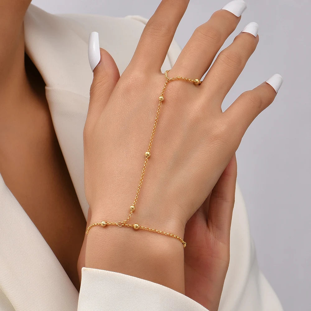 Chain bracelet finger rings gold color